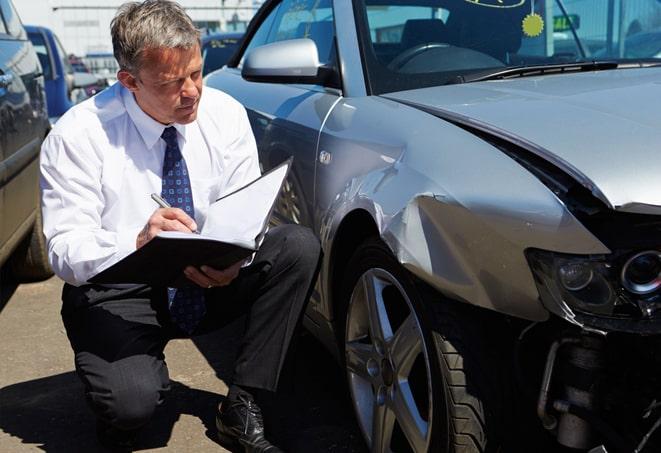 a car with insurance paperwork in the glove compartment